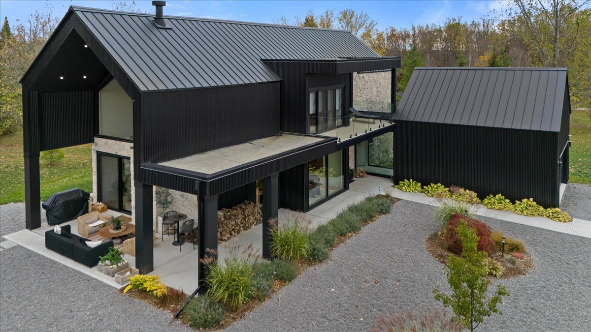 Aerial study of the home and the surrounding land.